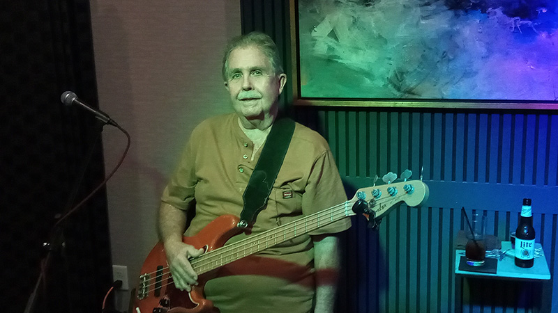 Rich with his bass waiting to start.